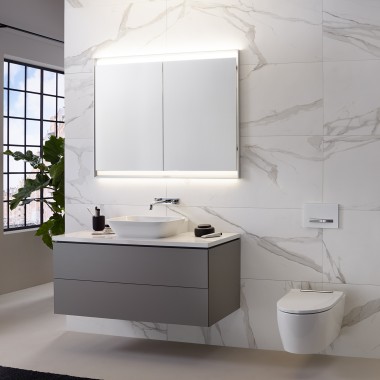 Wall with marble tiles, Geberit ONE washbasin and mirror cabinet with ComfortLight